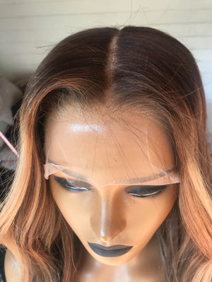 Model wearing brown balayage 22-inch HD lace human hair wig in body wave texture – Nuola Wigs.