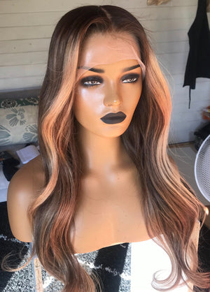 Model wearing brown balayage 22-inch HD lace human hair wig in body wave texture – Nuola Wigs.