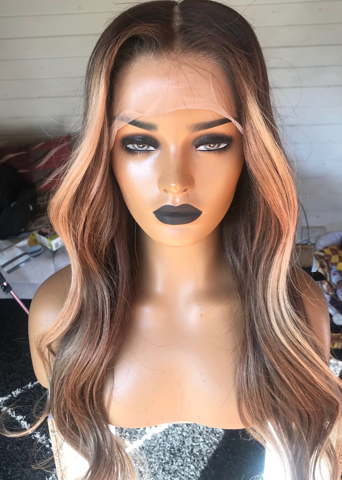 Model wearing brown balayage 22-inch HD lace human hair wig in body wave texture – Nuola Wigs.