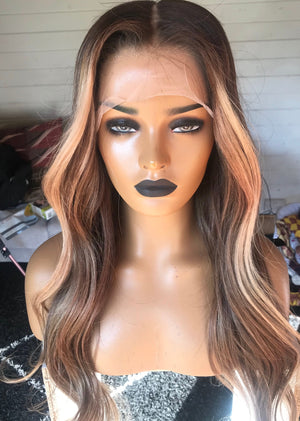 Model wearing brown balayage 22-inch HD lace human hair wig in body wave texture – Nuola Wigs.