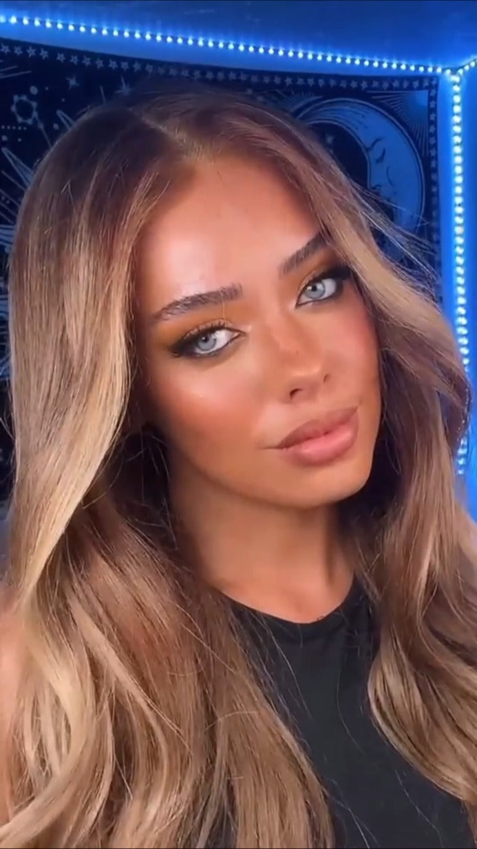 Model wearing brown balayage 22-inch HD lace human hair wig in body wave texture – Nuola Wigs.