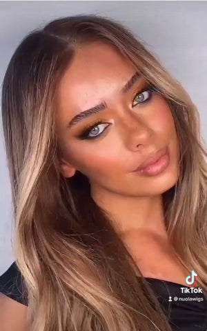 Model wearing brown balayage 22-inch HD lace human hair wig in body wave texture – Nuola Wigs.