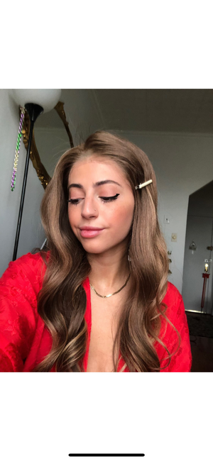 Model wearing brown balayage 22-inch HD lace human hair wig in body wave texture – Nuola Wigs.