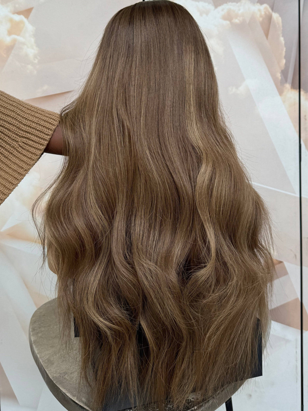 Model wearing brown balayage 24-inch HD lace human hair wig in body wave texture – Nuola Wigs.