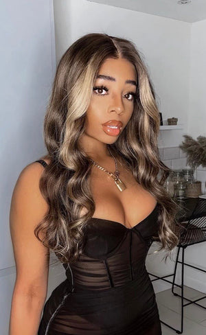 Model wearing brown balayage 24-inch HD lace human hair wig in body wave texture – Nuola Wigs.