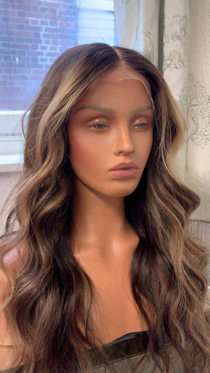 Model wearing brown balayage 24-inch HD lace human hair wig in body wave texture – Nuola Wigs.