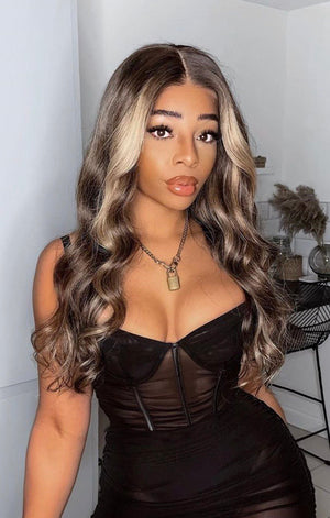 Model wearing brown balayage 24-inch HD lace human hair wig in body wave texture – Nuola Wigs.