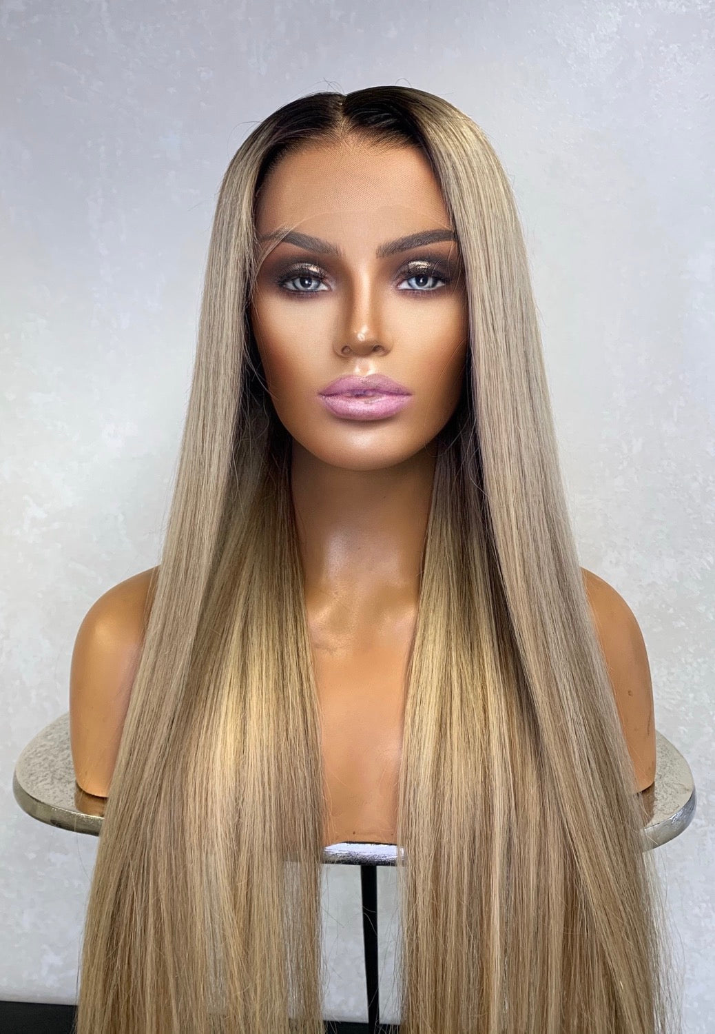 Model wearing brown balayage 24-inch HD lace human hair wig in body wave texture – Nuola Wigs.