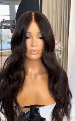 Model wearing brown balayage 24-inch HD lace human hair wig in body wave texture – Nuola Wigs.